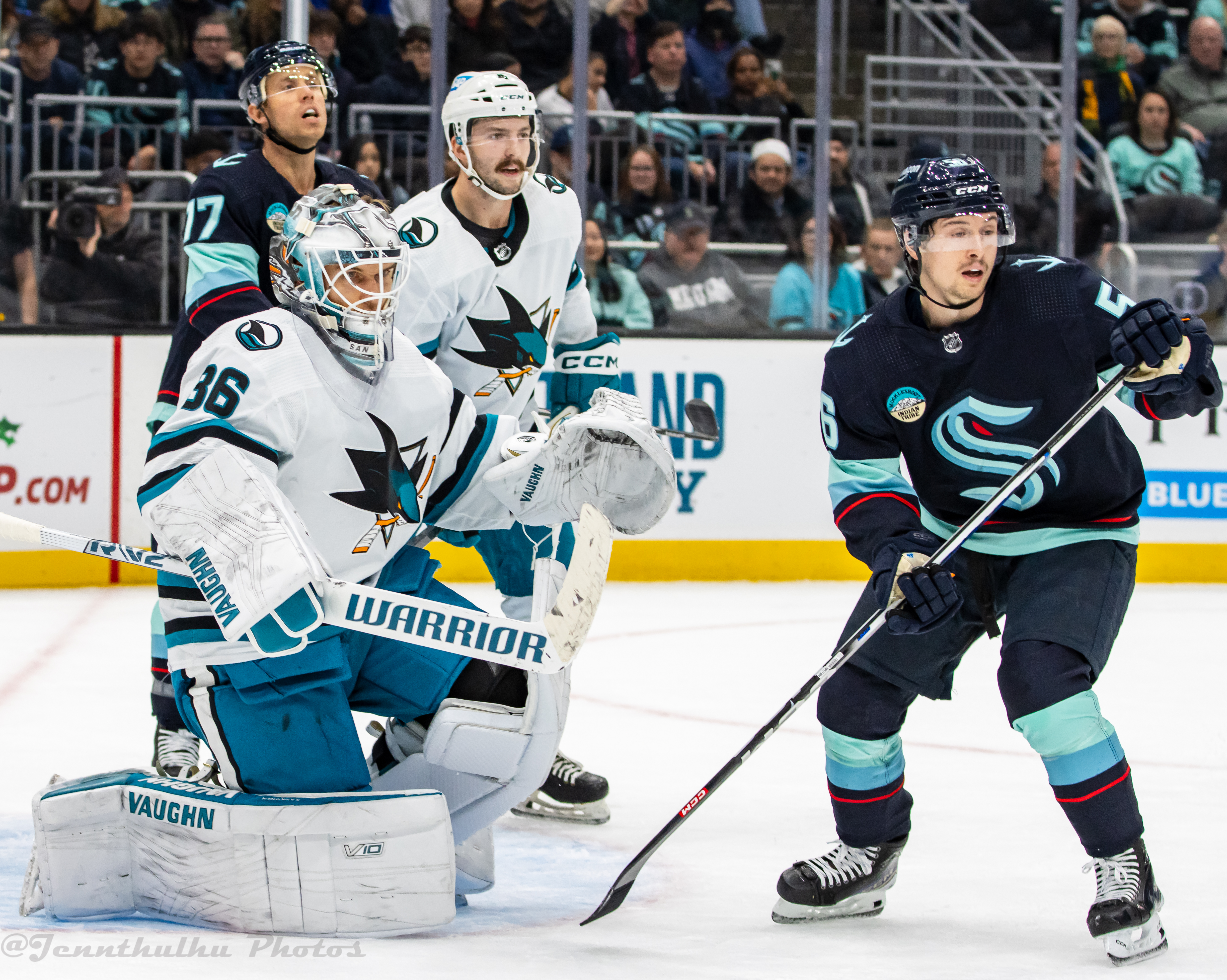Kyle Burroughs on the ice with teammates during Sharks vs Kraken