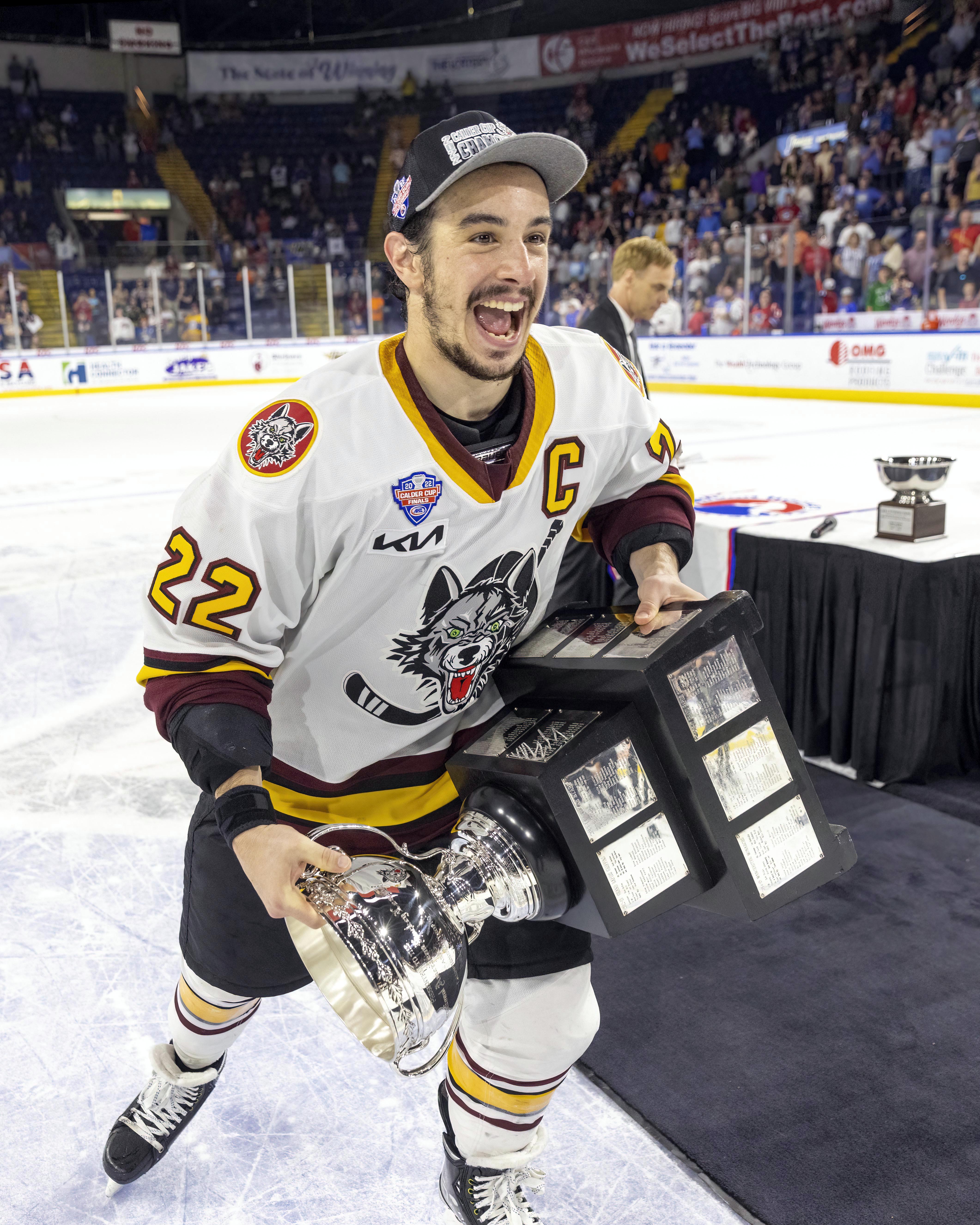 Andrew Poturalski holding the 2022 Calder Cup