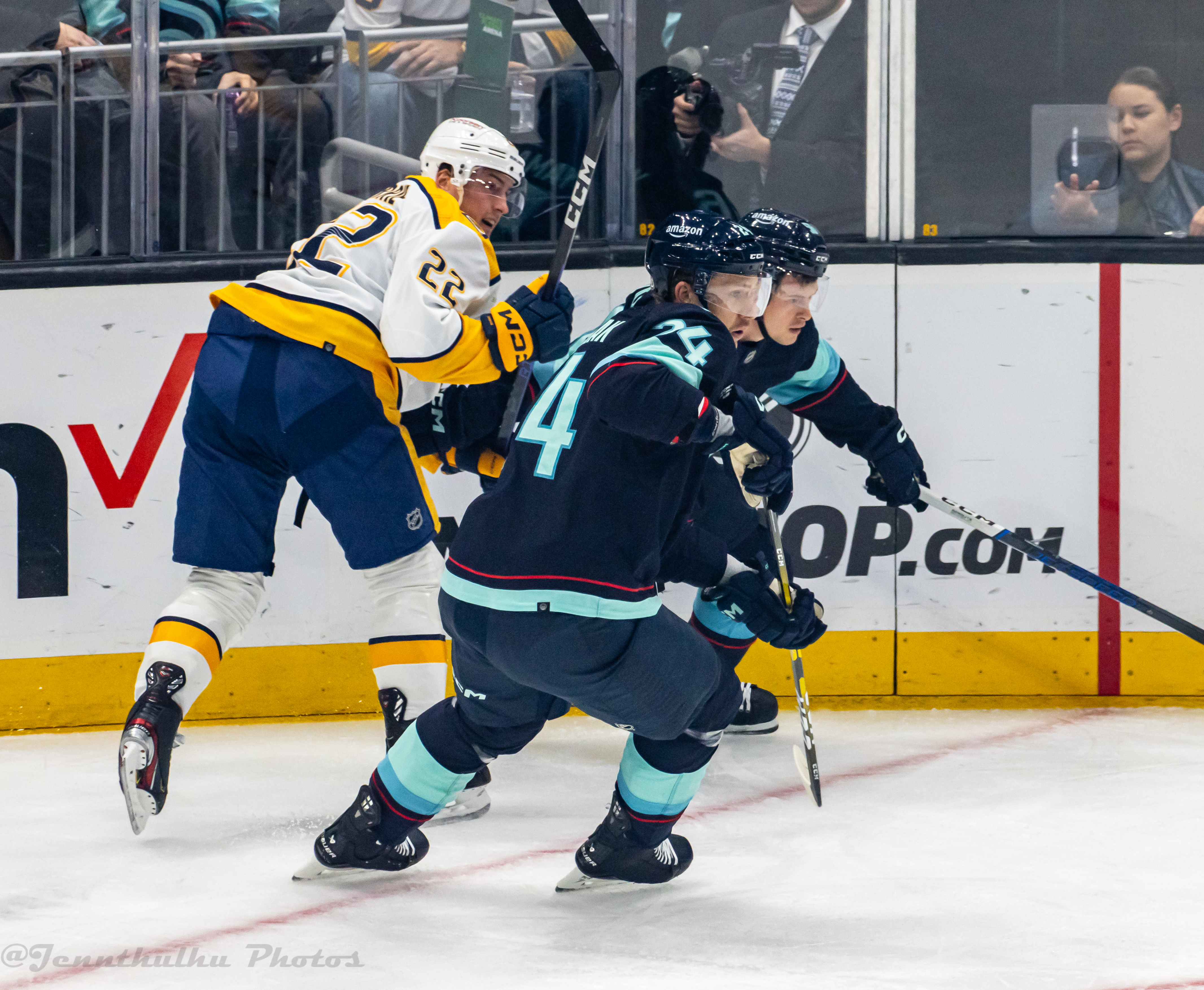 Tyson Barrie surrounded by opponents during Predators–Kraken