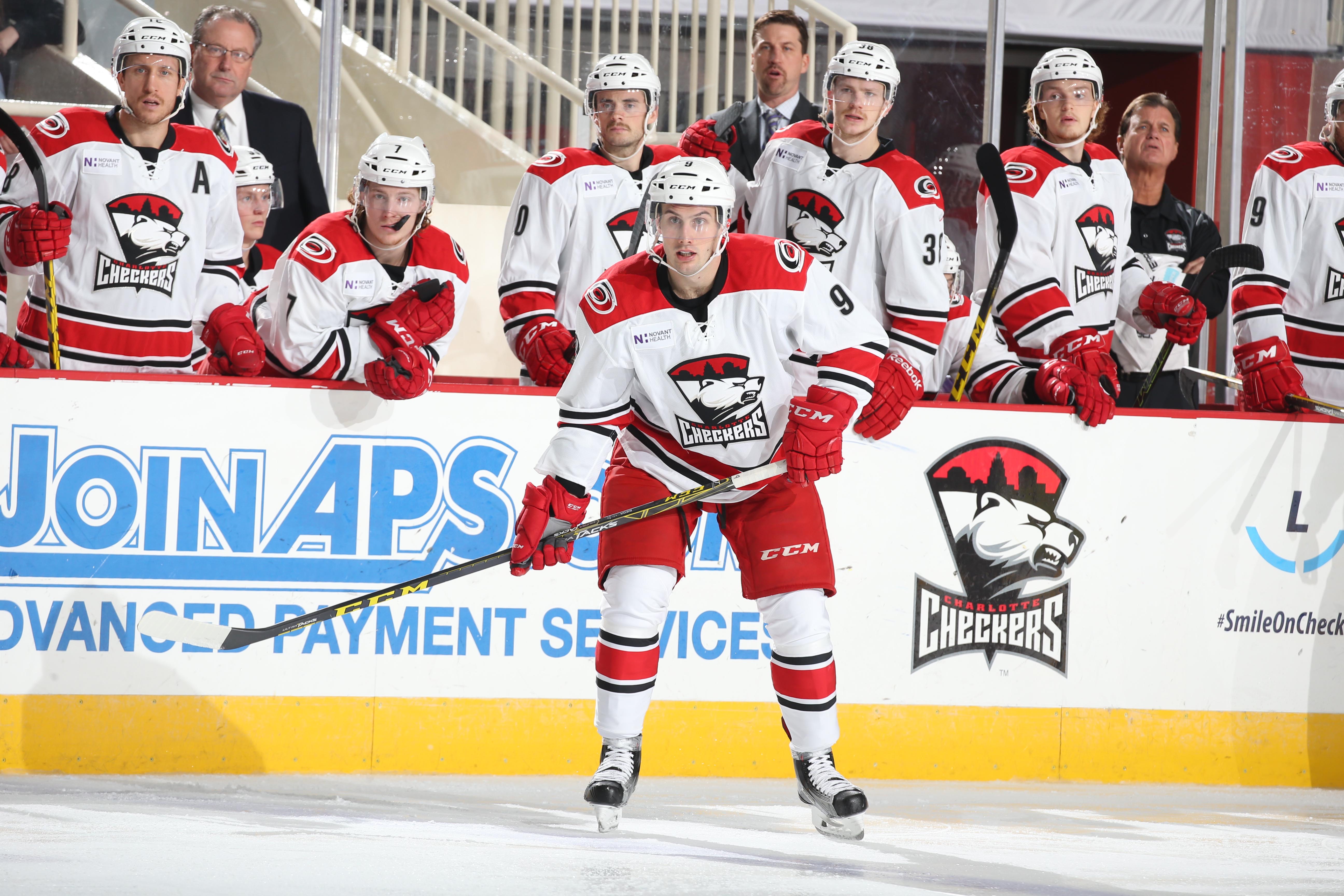 Derek Ryan seated on the Charlotte Checkers bench