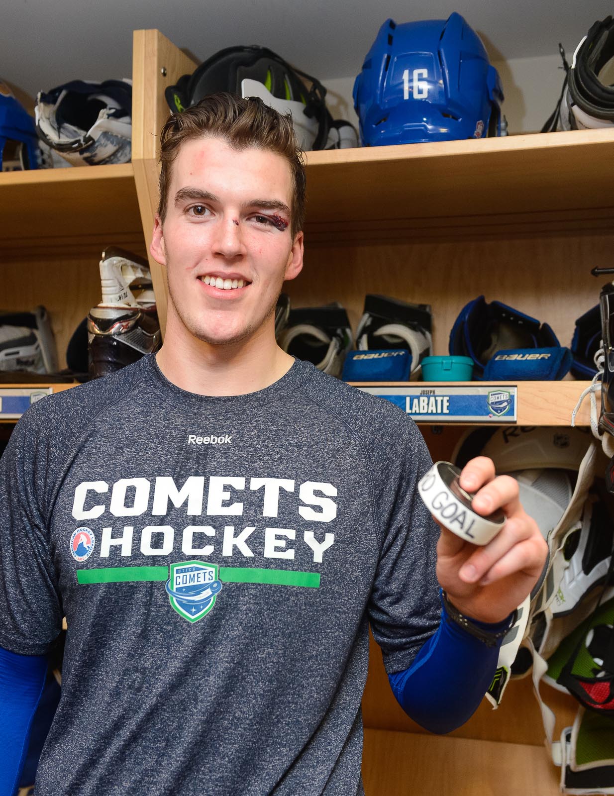Joseph LaBate in Utica Comets uniform skating on the ice