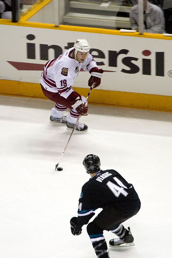 Marc-Edouard Vlasic battling Shane Doan