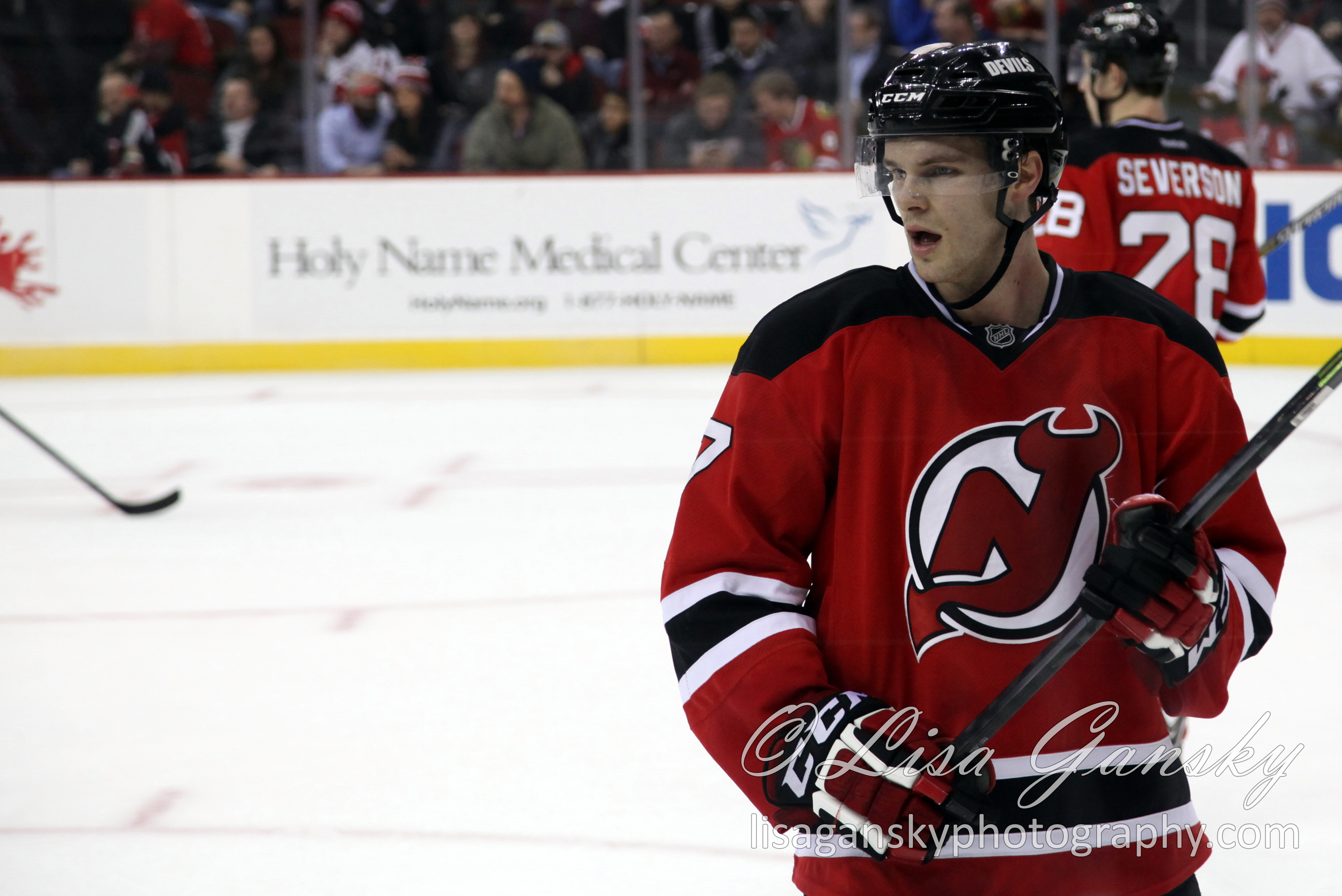 Jon Merrill in game uniform on the ice, 2014