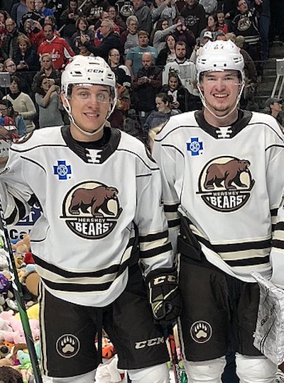 Martin Fehervary and Alex Alexeyev side by side at Hershey Bears Teddy Bear Toss