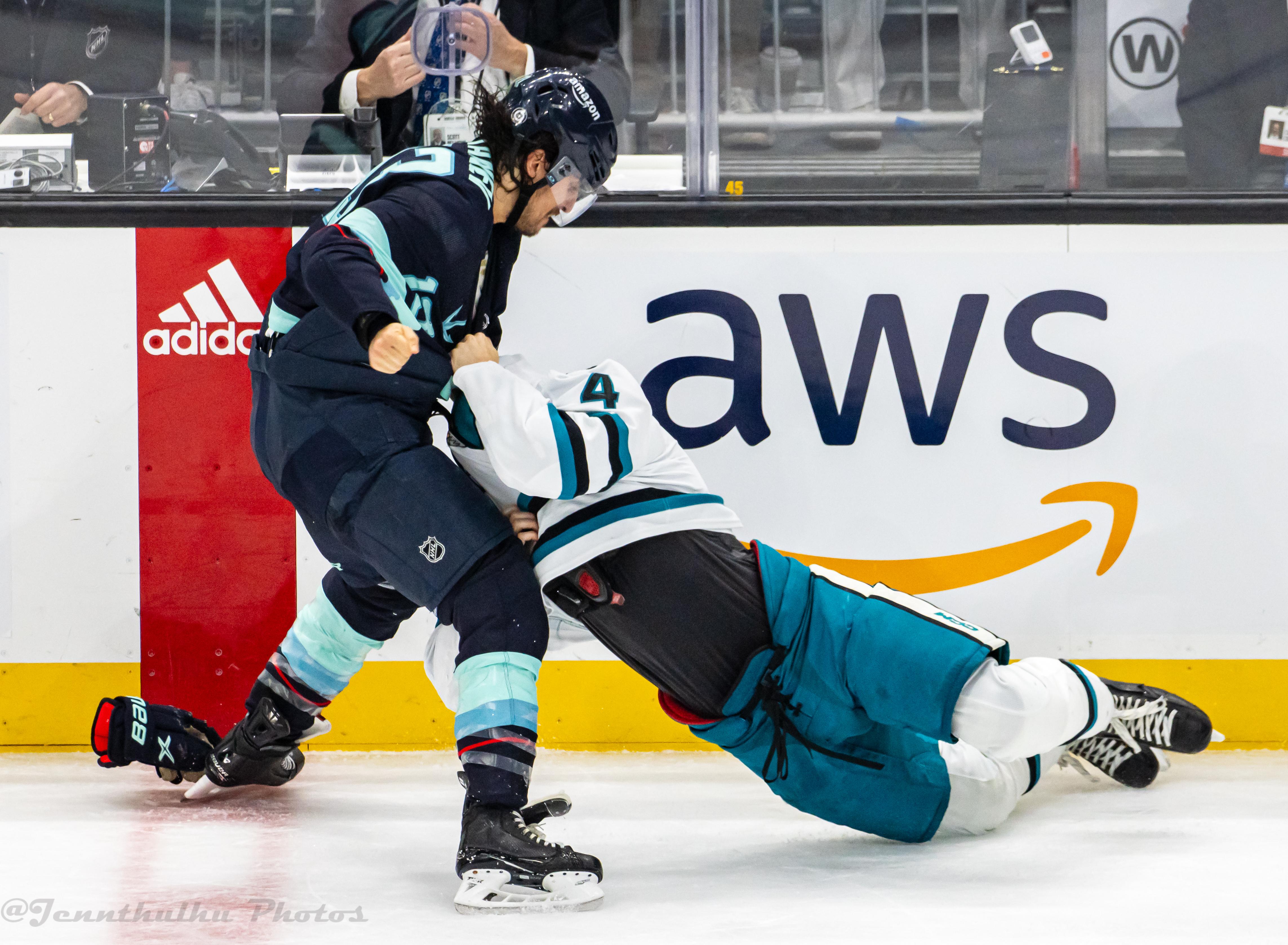 Kyle Burroughs fighting Brandon Tanev during Sharks vs Kraken