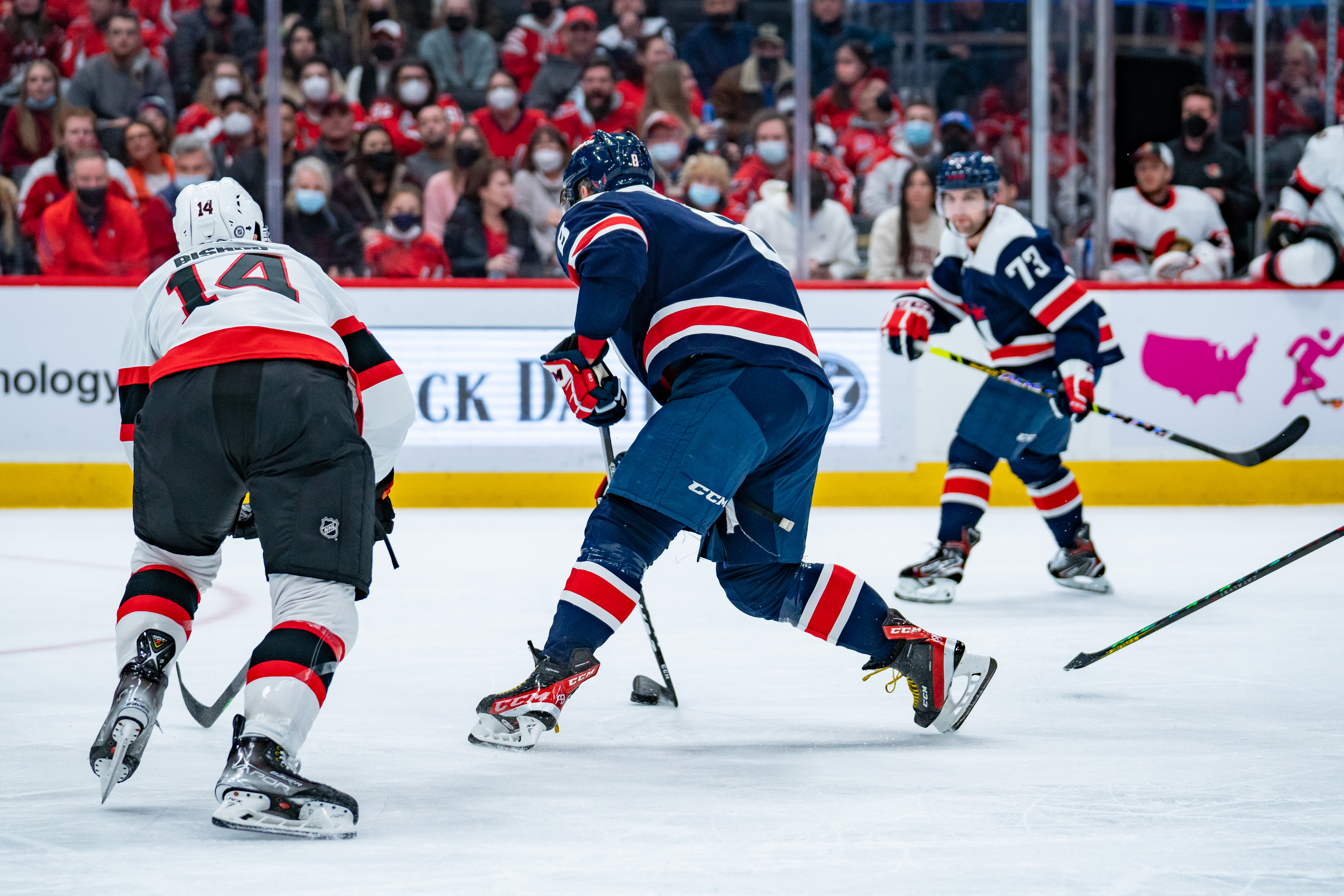 Clark Bishop beside Alexander Ovechkin during Capitals game, 2022