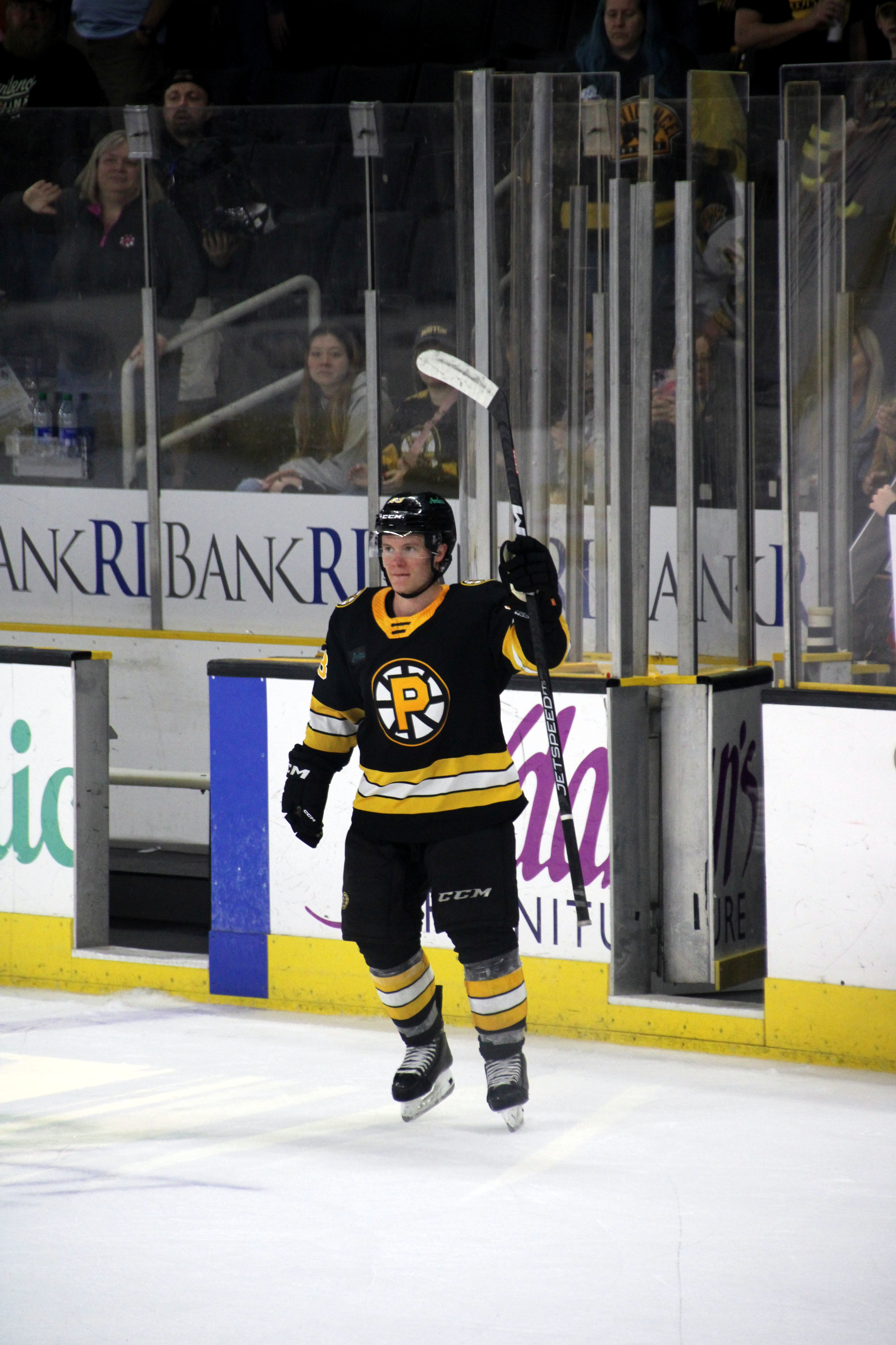 Jack Ahcan with Providence Bruins jersey in 2023