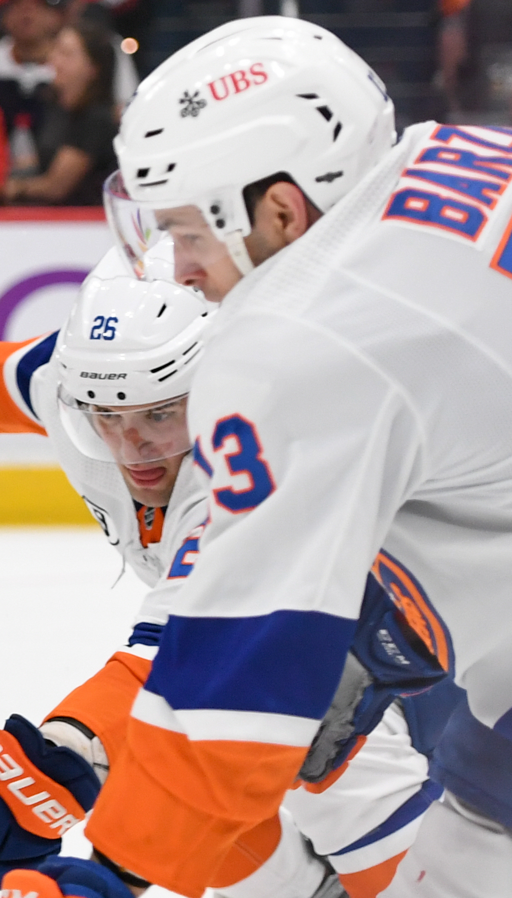 Oliver Wahlstrom battling for the puck near Alex Ovechkin