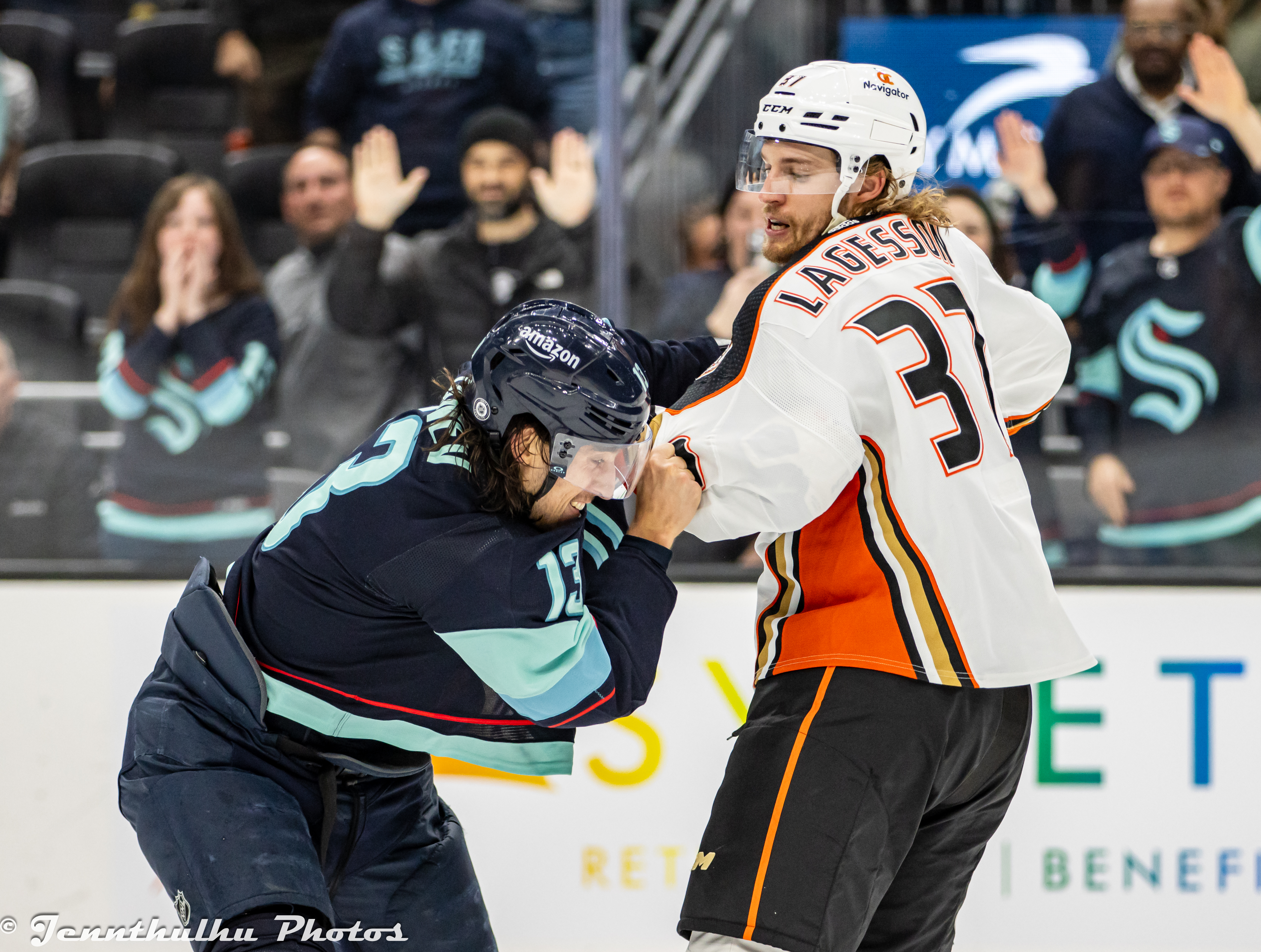 William Lagesson fighting Chris Tanev on the ice