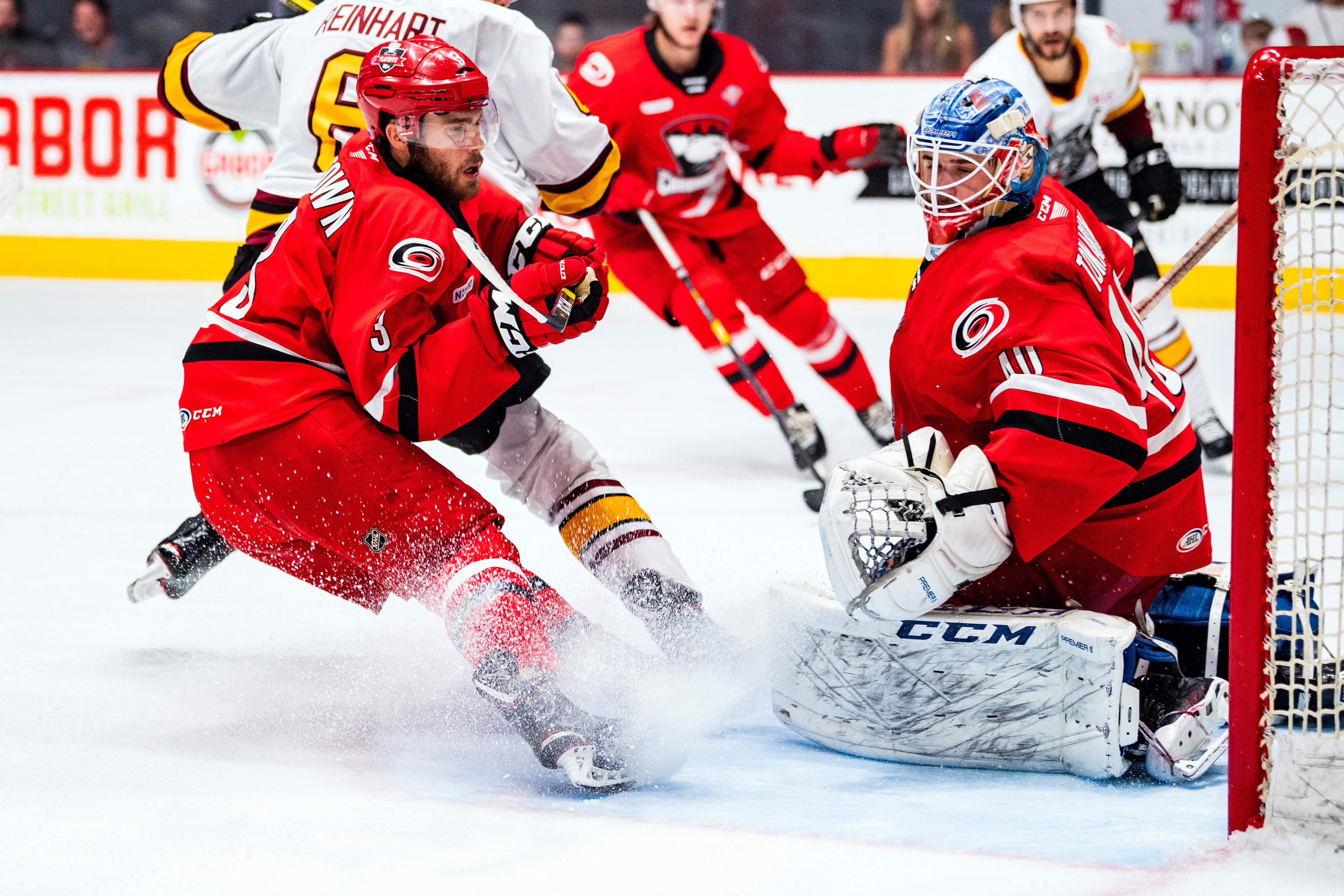 Dustin Tokarski alongside Roland McKeown with the Charlotte Checkers